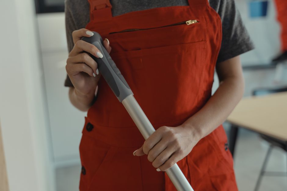Friendly professional cleaning service worker