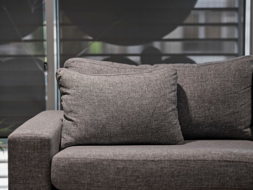 Detail of cleaning a fabric sofa
